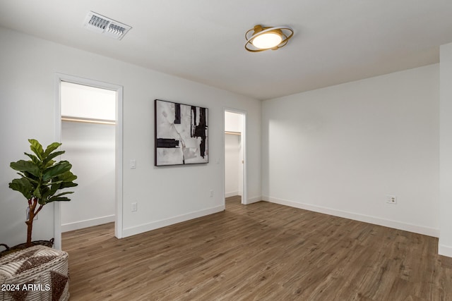 empty room featuring dark wood-type flooring