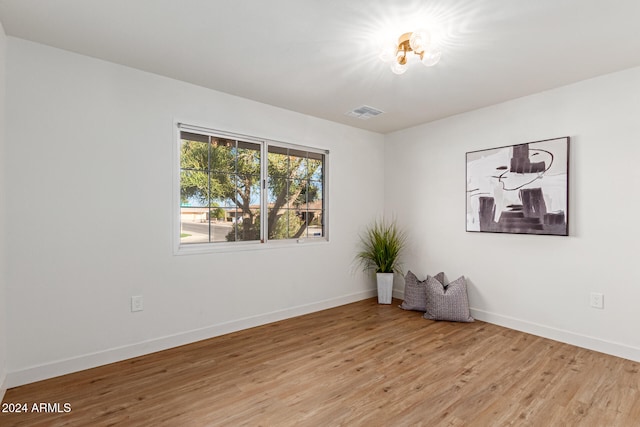 spare room with light hardwood / wood-style flooring