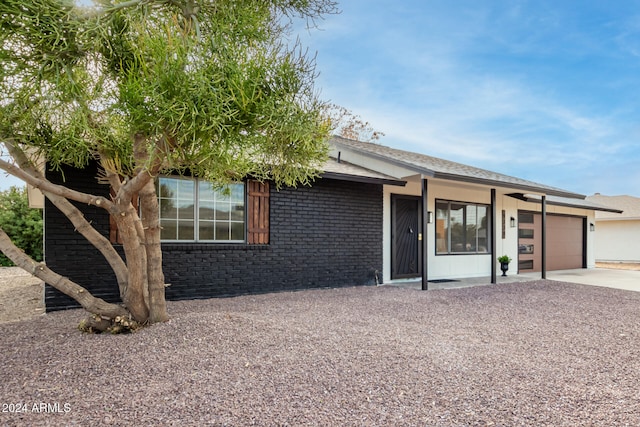 single story home with a garage