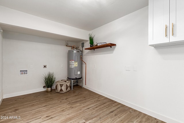 utility room with electric water heater