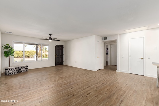 spare room with light hardwood / wood-style floors and ceiling fan