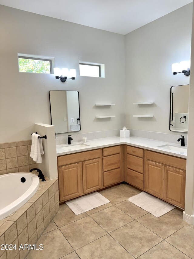 bathroom featuring vanity, tile patterned floors, and a healthy amount of sunlight