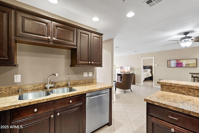 4200 N Miller Rd Unit 408, Scottsdale, AZ 85251 - kitchen featuring dishwasher, dark brown cabinetry, light tile patterned floors, light stone countertops, and recessed lighting