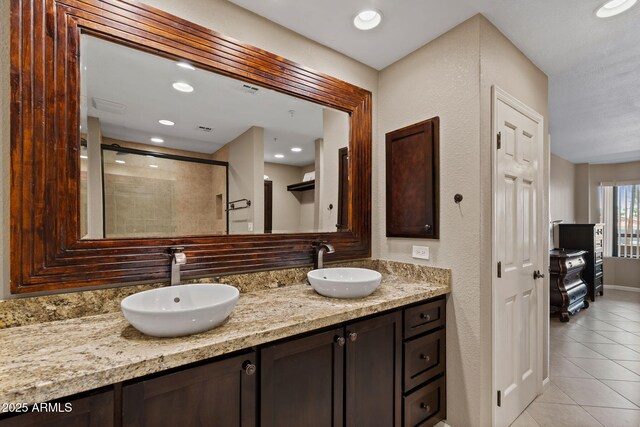4200 N Miller Rd Unit 408, Scottsdale, AZ 85251 - full bathroom with tile patterned flooring, a shower stall, double vanity, and recessed lighting