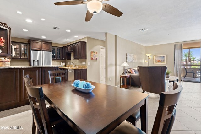 4200 N Miller Rd Unit 408, Scottsdale, AZ 85251 - dining area featuring light tile patterned flooring, recessed lighting, and a ceiling fan