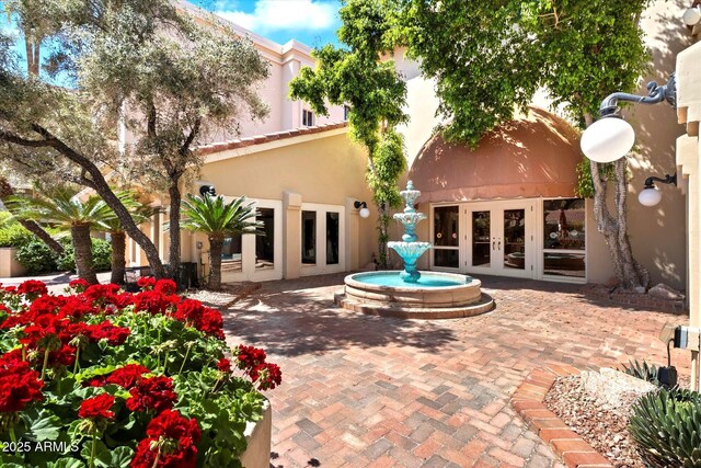 4200 N Miller Rd Unit 408, Scottsdale, AZ 85251 - rear view of house with french doors and stucco siding