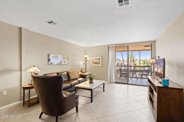 4200 N Miller Rd Unit 408, Scottsdale, AZ 85251 - living room with a wall of windows and light tile patterned flooring