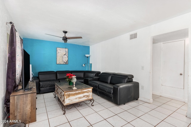 tiled living room featuring ceiling fan