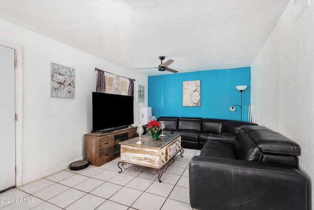 living room featuring ceiling fan and light tile patterned flooring