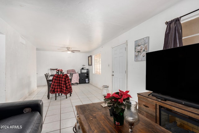 tiled living room with ceiling fan