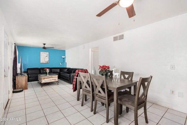 dining space featuring light tile patterned floors and ceiling fan