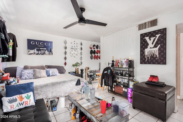 bedroom featuring light tile patterned floors and ceiling fan