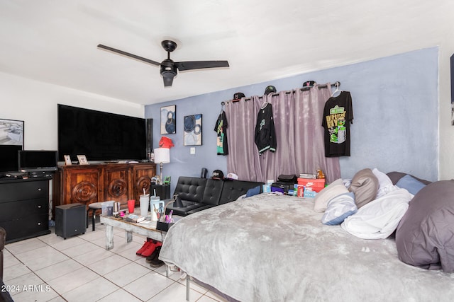 bedroom with ceiling fan and light tile patterned floors