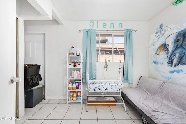 living area with tile patterned floors