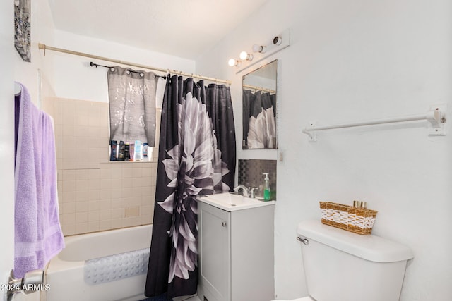 full bathroom featuring vanity, toilet, and shower / tub combo