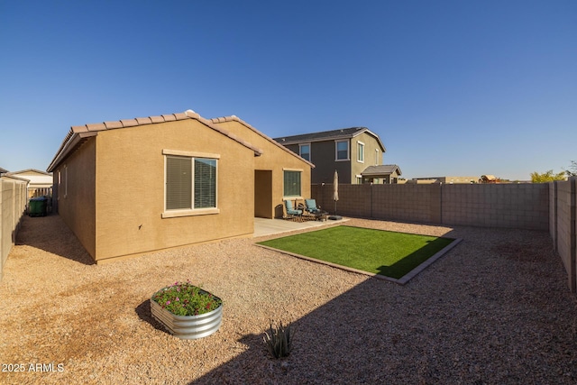 back of house featuring a patio