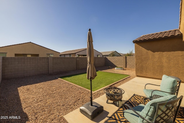 view of patio / terrace with an outdoor fire pit