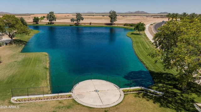 view of swimming pool featuring a water and mountain view