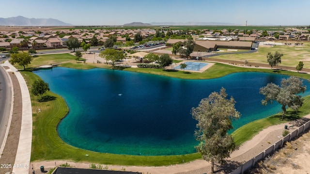 drone / aerial view featuring a water and mountain view