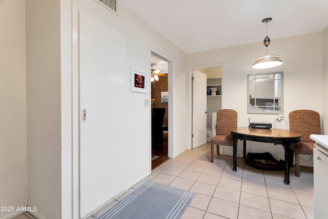 dining space featuring light tile patterned flooring