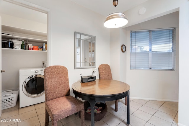 tiled dining space featuring washer / clothes dryer