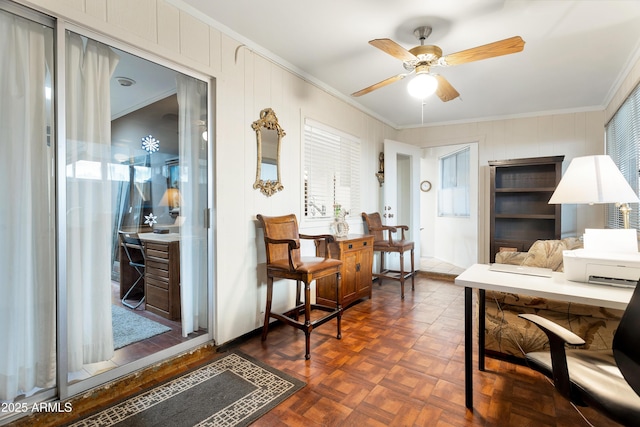 home office featuring ornamental molding, dark parquet flooring, and ceiling fan