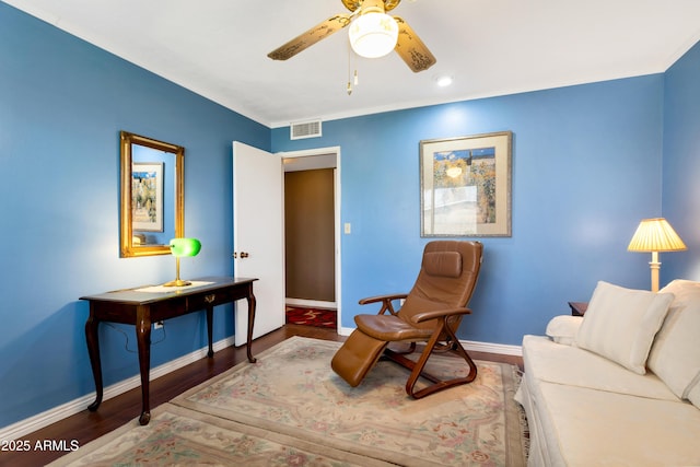 living area with hardwood / wood-style flooring and ceiling fan