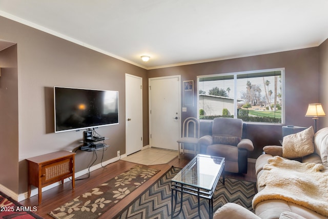 living room featuring light hardwood / wood-style flooring and ornamental molding