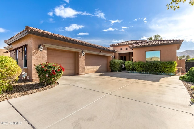 1819 W Magdalena Ln, Phoenix, AZ 85041 - mediterranean / spanish home with a mountain view and a garage