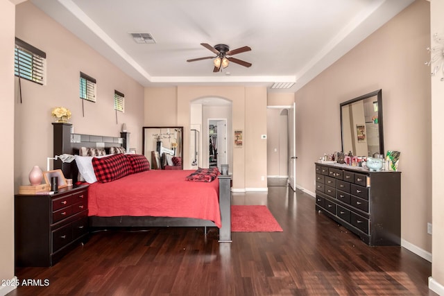 bedroom featuring ceiling fan and dark wood-type flooring