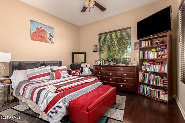 bedroom featuring ceiling fan and dark wood-type flooring