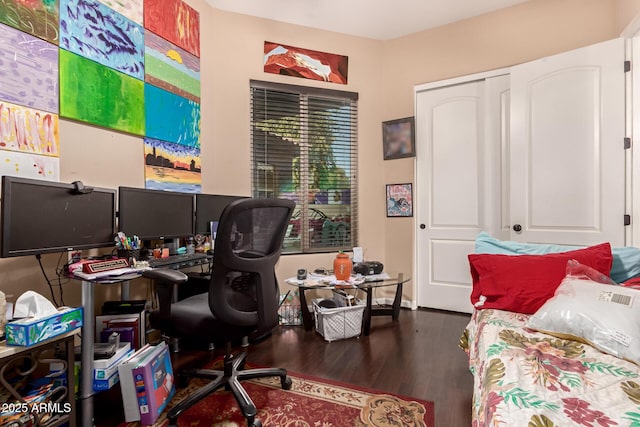 office with dark hardwood / wood-style flooring