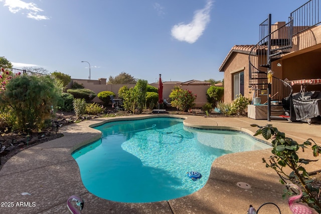 view of swimming pool featuring a patio area