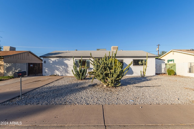 ranch-style house featuring a carport