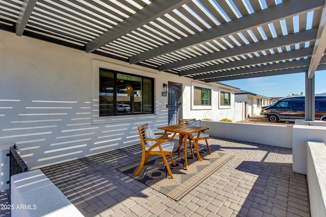 view of patio / terrace with outdoor dining area and a pergola