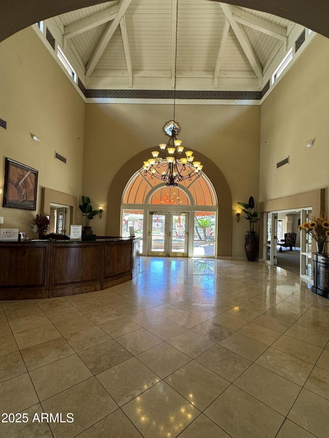 interior space with wood ceiling, french doors, visible vents, and a chandelier