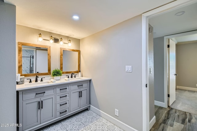 bathroom with vanity and hardwood / wood-style flooring