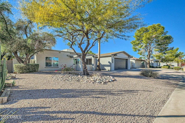 ranch-style home featuring a garage