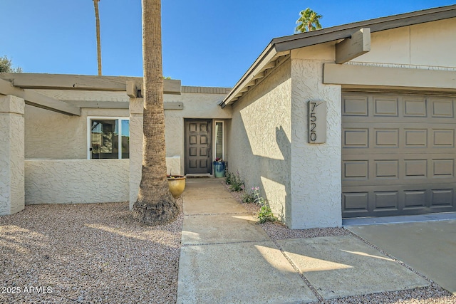 doorway to property featuring a garage