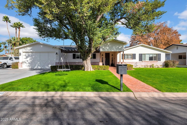 view of front of house with a front lawn and a garage