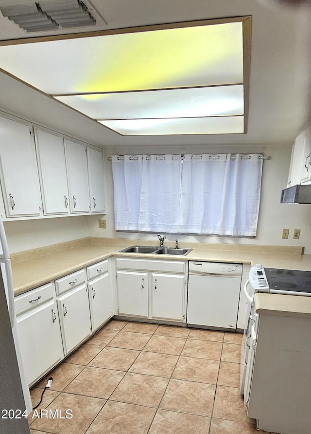 kitchen with white cabinets, white appliances, and sink