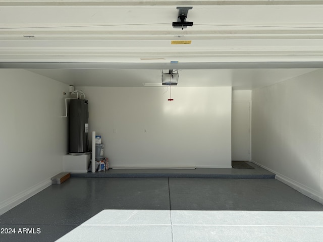 garage featuring a garage door opener and water heater