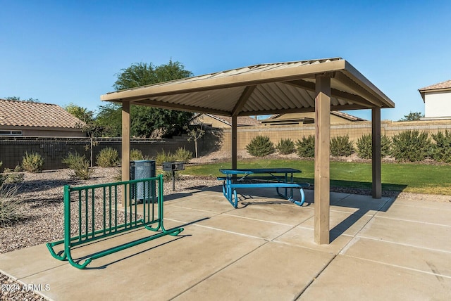 view of home's community featuring a gazebo, a lawn, and a patio