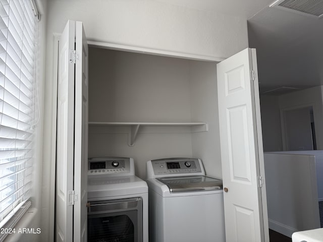 laundry area with separate washer and dryer