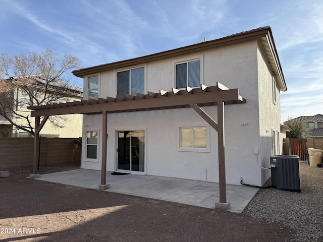 rear view of property with a patio and central air condition unit