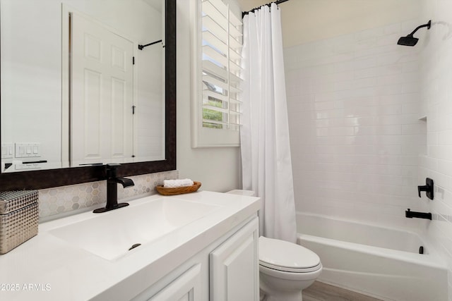 bathroom with vanity, toilet, and shower / bathtub combination with curtain