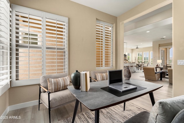 interior space featuring recessed lighting, ceiling fan, baseboards, and wood finished floors