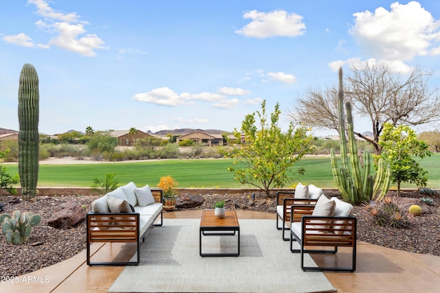 view of home's community featuring a patio area, an outdoor hangout area, and a lawn