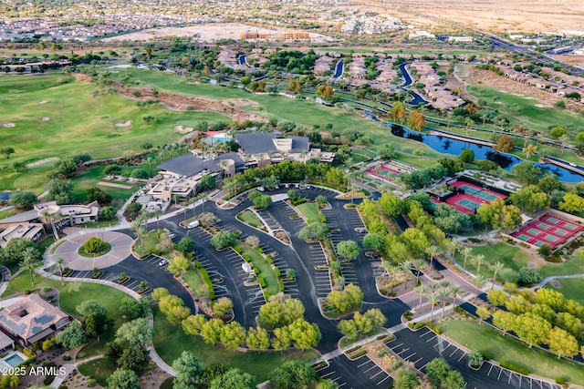 drone / aerial view featuring a water view and a residential view