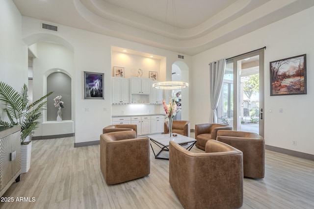 4915 N Greentree Dr, Litchfield Park, AZ 85340 - living room with a raised ceiling and light wood-type flooring